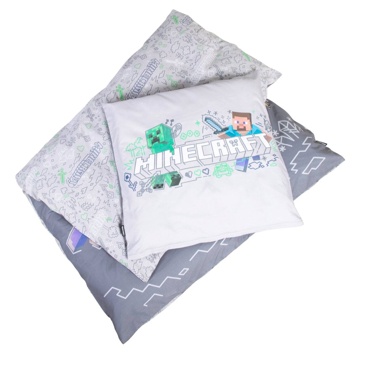 Minecraft Bettwäsche-Set mit Kissenbezug und Deckenbezug in Grau/Weiß, mit Minecraft-Logo sowie Steve- und Creeper-Motiv, schräg von oben fotografiert