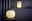 Zwei moderne, kugelförmige Tischlampen aus Messing mit warmem Licht, eine im Vordergrund und eine im Hintergrund auf einem Regal platziert.