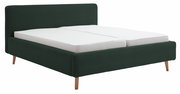 Polsterbettgestell in dunklem Grün mit Holzfüßen, seitliche Perspektive