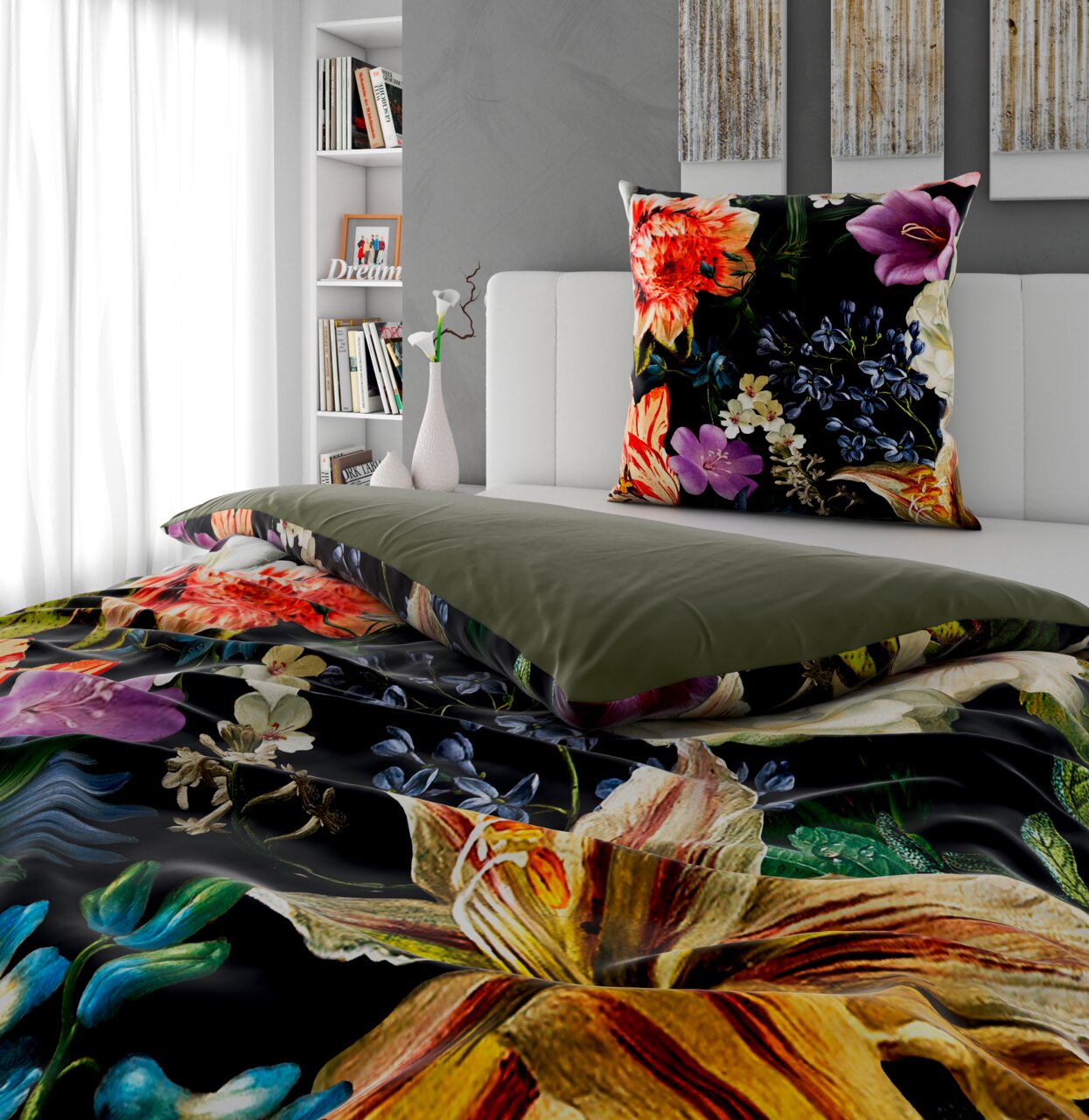 Wendebettwäsche mit floralem Muster in Nahaufnahme, auf einem Bett arrangiert. Die Vorderseite zeigt bunte Blumen auf dunklem Hintergrund, die Rückseite ist einfarbig grün. Perspektive von der Seite des Bettes.