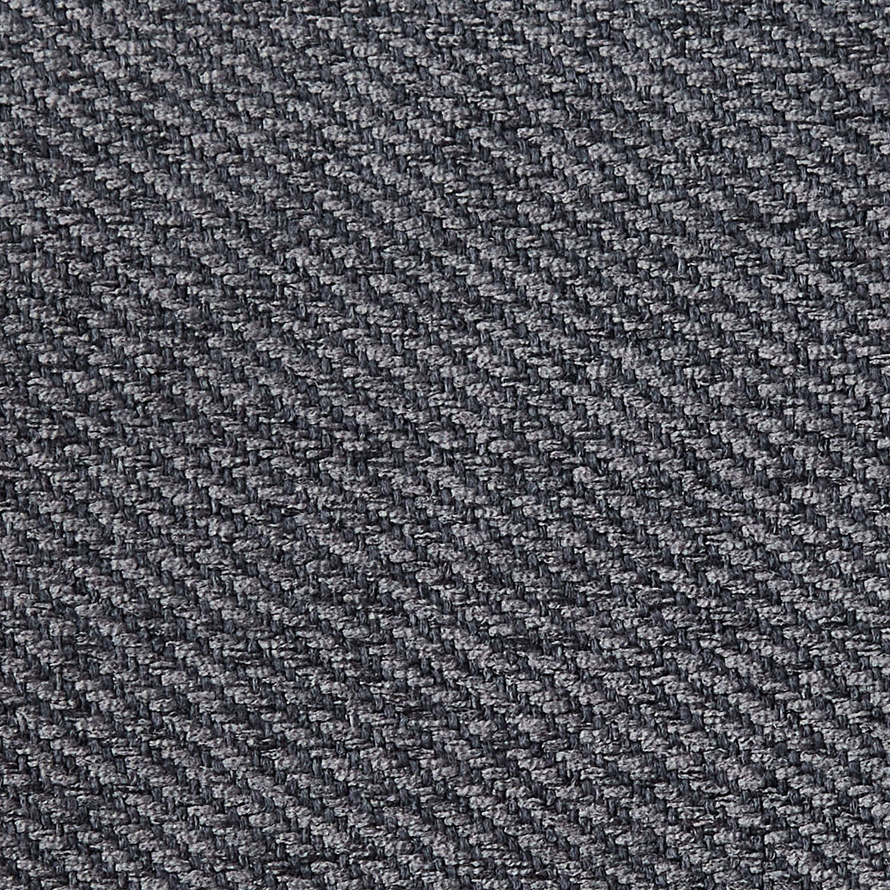 Nahaufnahme eines grauen Stoffmusters in diagonaler Webart