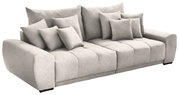 Grote, lichtgrijze big-sofa met verschillende kussens, zijaanzicht