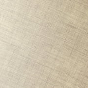 Nahaufnahme eines beigen Stoffes mit feiner Textur, schräg fotografiert.