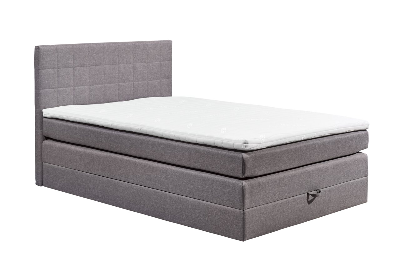 Graues Boxspringbett XORA HAWAII in seitlicher Perspektive mit gestepptem Kopfteil und weißer Matratze.