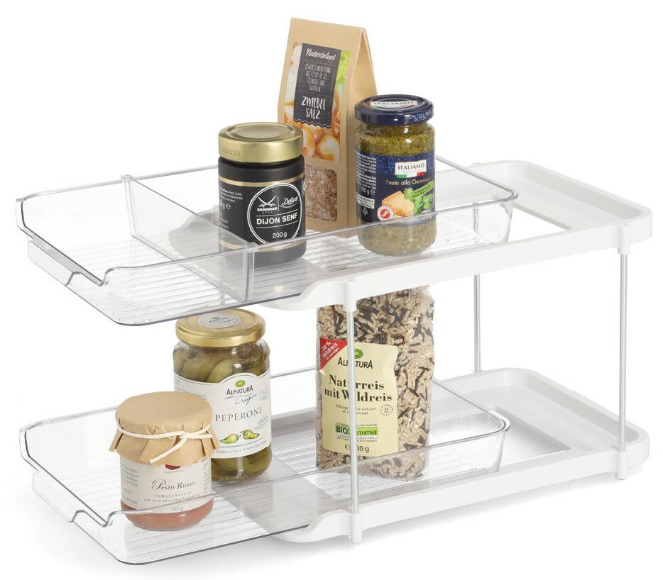 Zweistöckiges Etagenregal aus weißem Metall und transparentem Kunststoff, gefüllt mit verschiedenen Lebensmitteln, seitliche Perspektive.