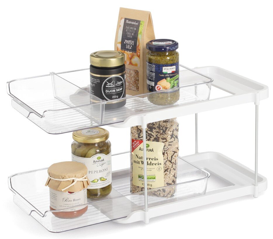 Zweistöckiges Etagenregal aus weißem Metall und transparentem Kunststoff, gefüllt mit verschiedenen Lebensmitteln, seitliche Perspektive.