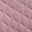 Nahaufnahme eines rosa gepolsterten Stoffes mit rautenförmigem Steppmuster, Draufsicht