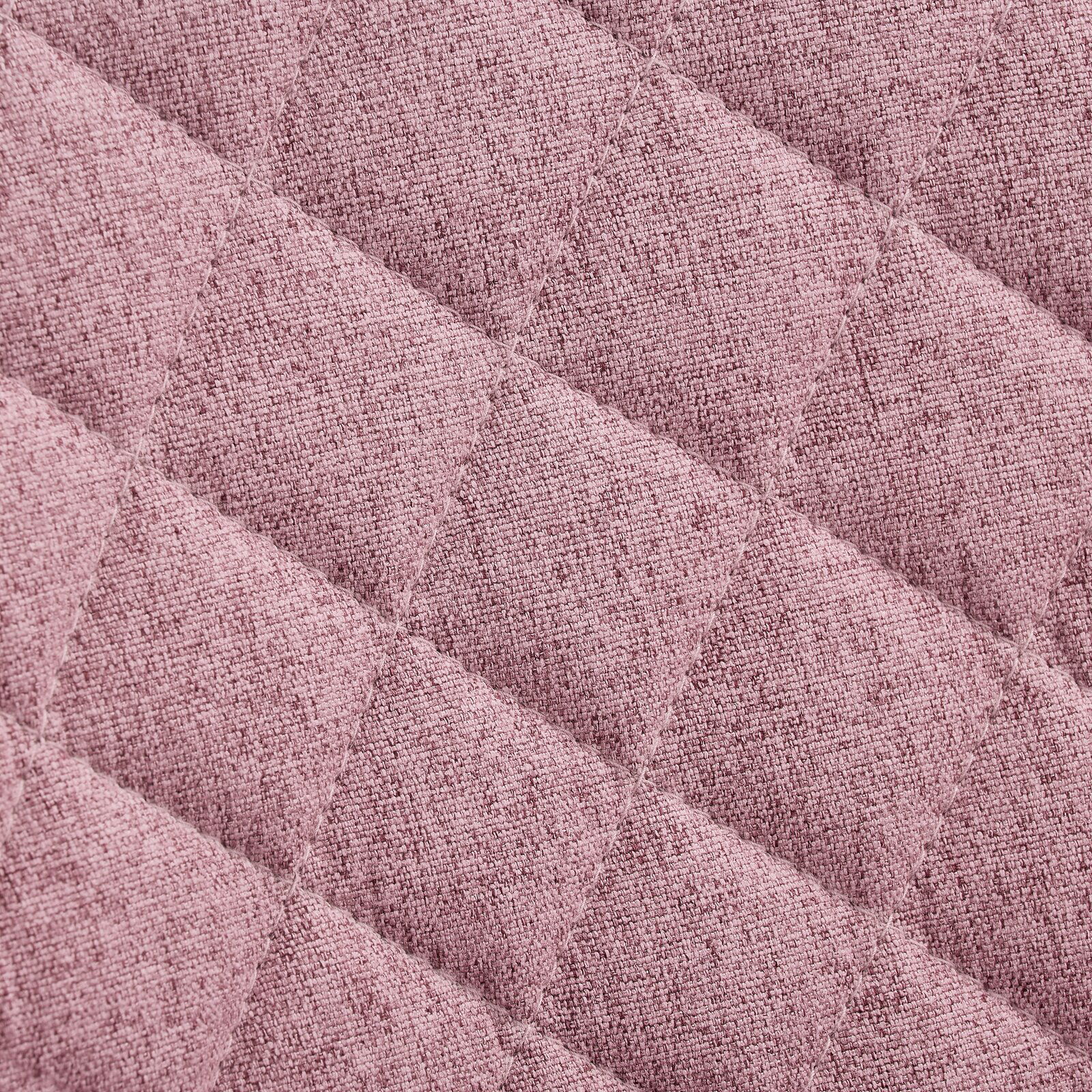 Nahaufnahme eines rosa gepolsterten Stoffes mit rautenförmigem Steppmuster, Draufsicht