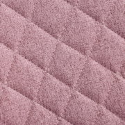 Nahaufnahme eines rosa gepolsterten Stoffes mit rautenförmigem Steppmuster, Draufsicht