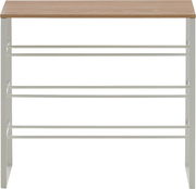 Schmales Schuhregal mit weißem Metallgestell, mehreren Ablageebenen und Holzplatte oben, frontale Ansicht.