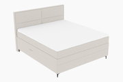 Boxspringbett in seitlicher Perspektive mit hellem Stoffbezug und schlichtem Design.