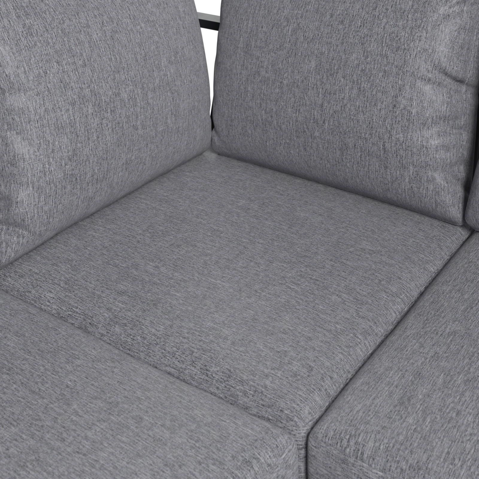 Nahaufnahme eines grauen Lounge-Sofas mit weichen Kissen und texturierter Oberfläche.