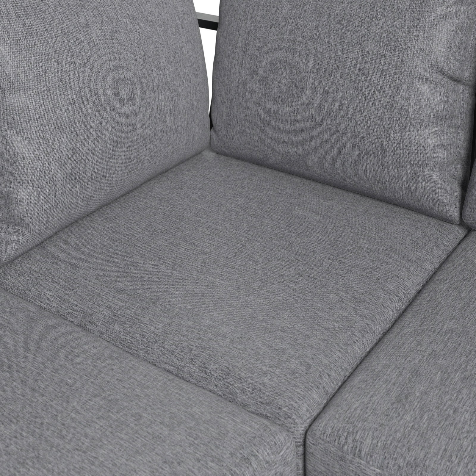 Nahaufnahme eines grauen Lounge-Sofas mit weichen Kissen und texturierter Oberfläche.