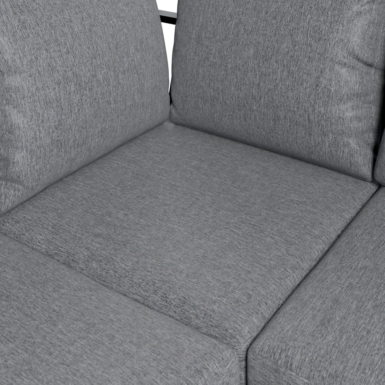 Nahaufnahme eines grauen Lounge-Sofas mit weichen Kissen und texturierter Oberfläche.