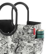 Loopshopper L mit schwarzem Griff und schwarz-weißem Baum-Muster, seitliche Perspektive, mit einer kleinen Tasche an der Seite.