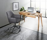 Moderner Schreibtisch aus Holz mit Schublade, Laptop und Dekorationen, seitliche Perspektive