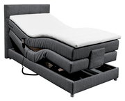 Graues Boxspringbett mit verstellbarem Kopf- und Fußteil, seitlicher Fernbedienung und moderner Optik, seitliche Perspektive