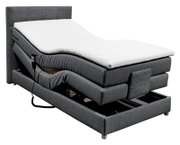 Grijs boxspringbed met verstelbaar hoofd- en voeteneinde, afstandsbediening aan de zijkant en een moderne uitstraling, zijaanzicht