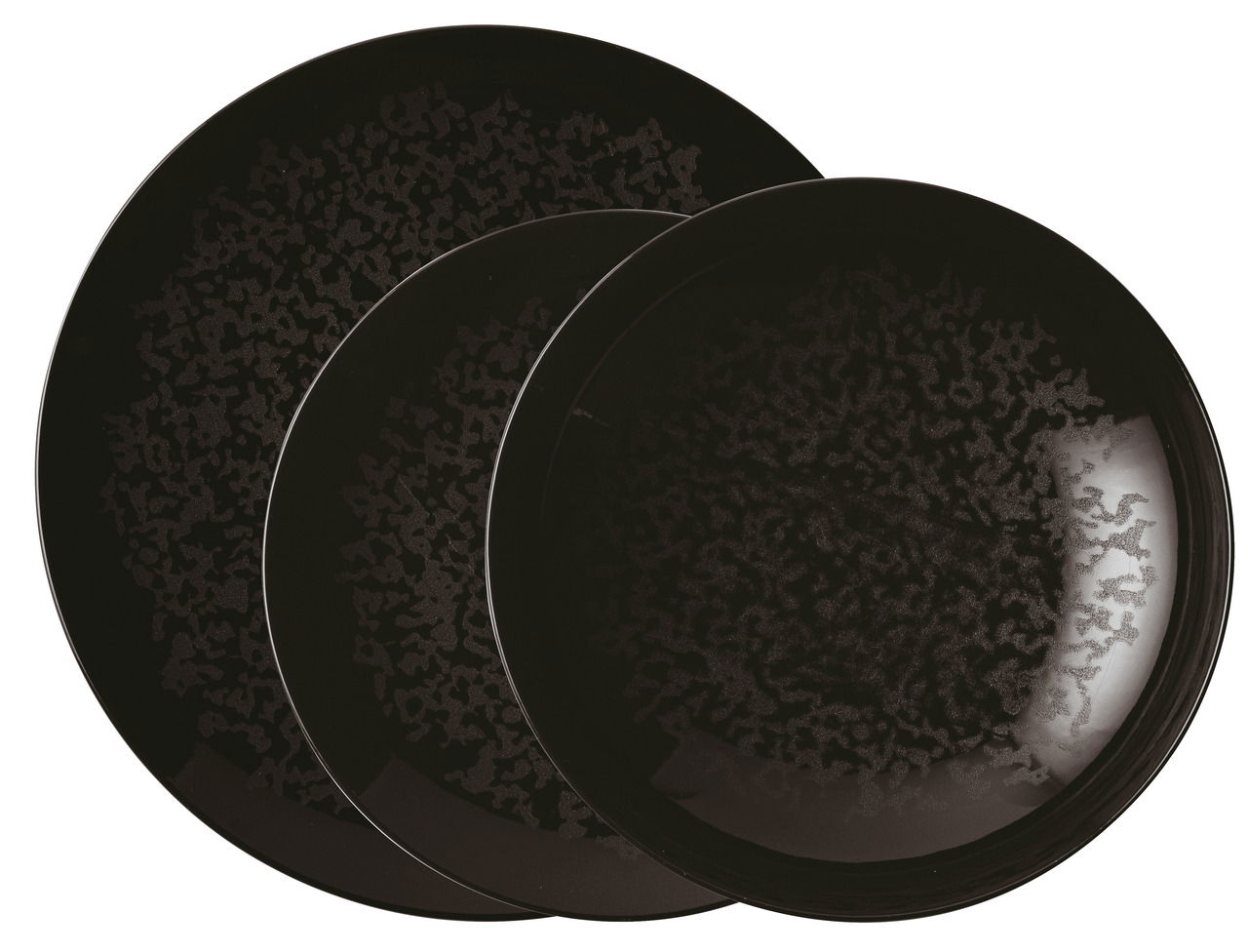 Draufsicht auf ein dreiteiliges, schwarzes Tellerset mit marmorierter Oberfläche.