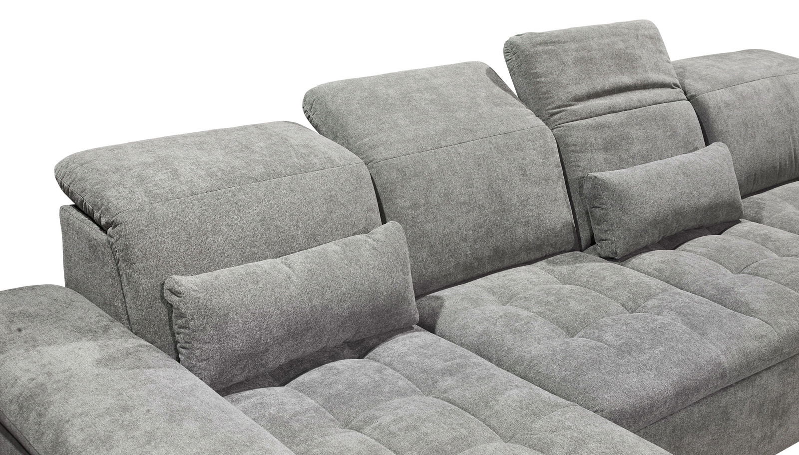 Graues Sofa mit verstellbaren Kopfstützen und Kissen, seitliche Perspektive