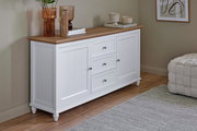 Weißes Sideboard mit Holzplatte, zwei Türen und drei Schubladen, seitliche Perspektive