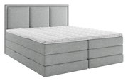 Graues Boxspringbett mit gestepptem Topper, seitliche Perspektive