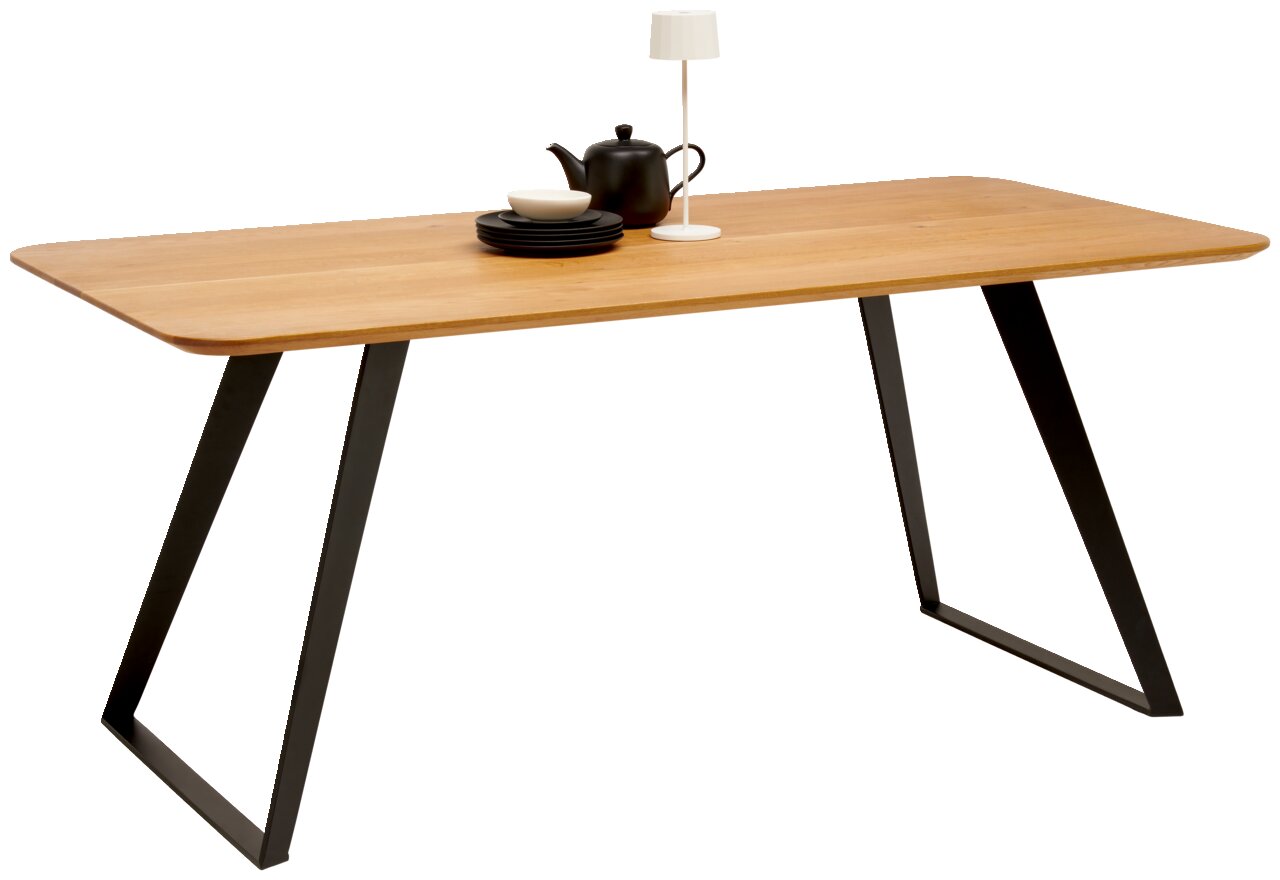 Voleo Esstisch 180x90 cm MALIBU Moderner Esstisch aus Holz mit schwarzen Metallbeinen, seitliche Perspektive, dekoriert mit Geschirr und Lampe.