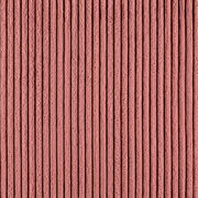 Nahaufnahme eines rosafarbenen, gerippten Stoffes, der für ein Funktionssofa verwendet wird.