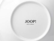 Unterseite einer weißen Espressotasse mit dem Aufdruck 'JOOP! MADE IN GERMANY'.