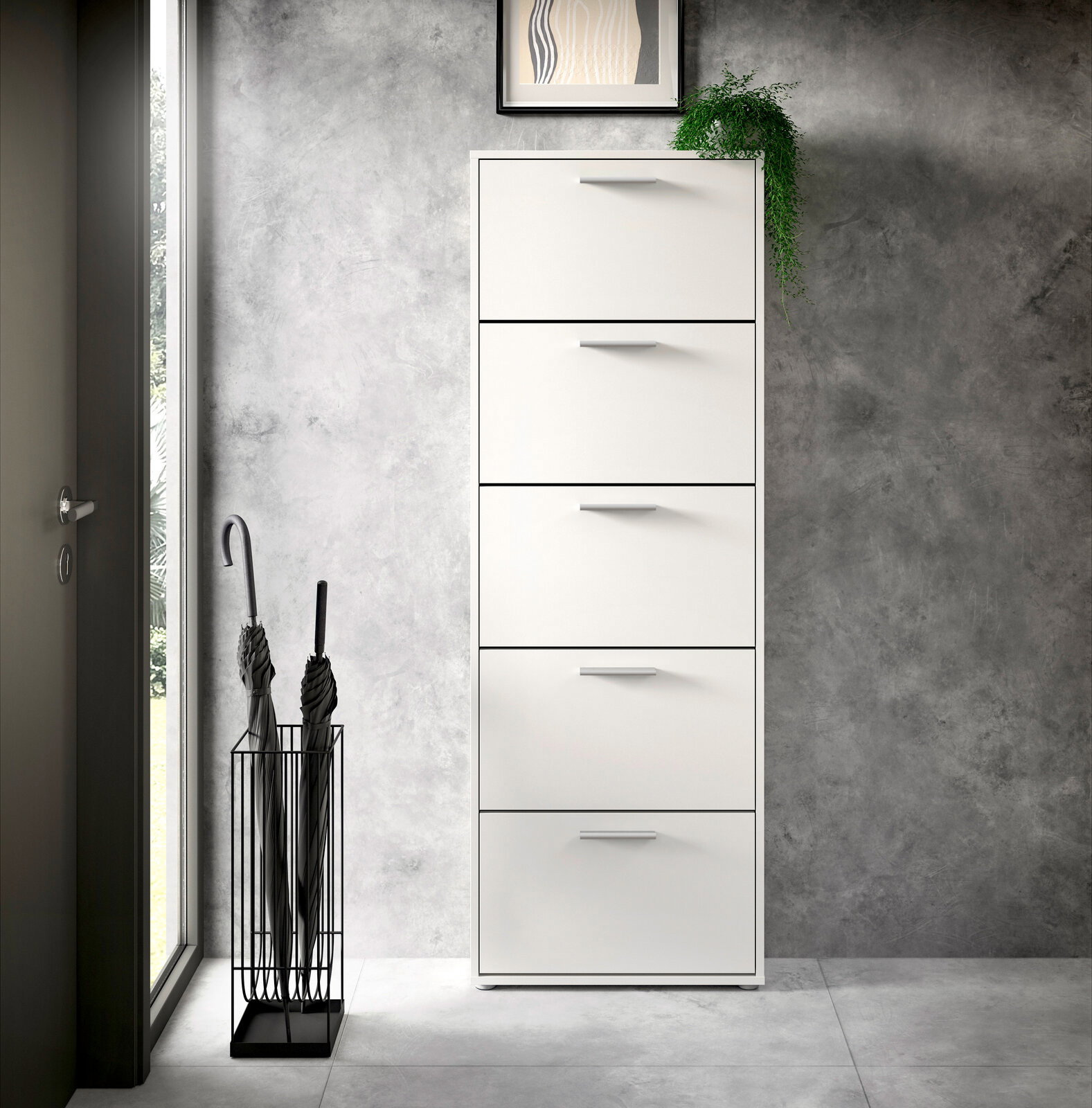 Moderner weißer Schuhkipper mit fünf Klappen, frontal fotografiert, neben einem Regenschirmständer in einem eleganten Eingangsbereich.