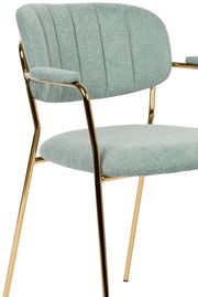 Moderner Armlehnstuhl mit hellgrünem Stoffbezug und goldenen Metallbeinen, seitliche Perspektive