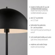 Moderne schwarze Stehleuchte „ALI“ aus der SCHÖNER WOHNEN Kollektion mit rundem Schirm und nach unten gerichteter Lichtabgabe, Detailansicht schräg von vorne links.