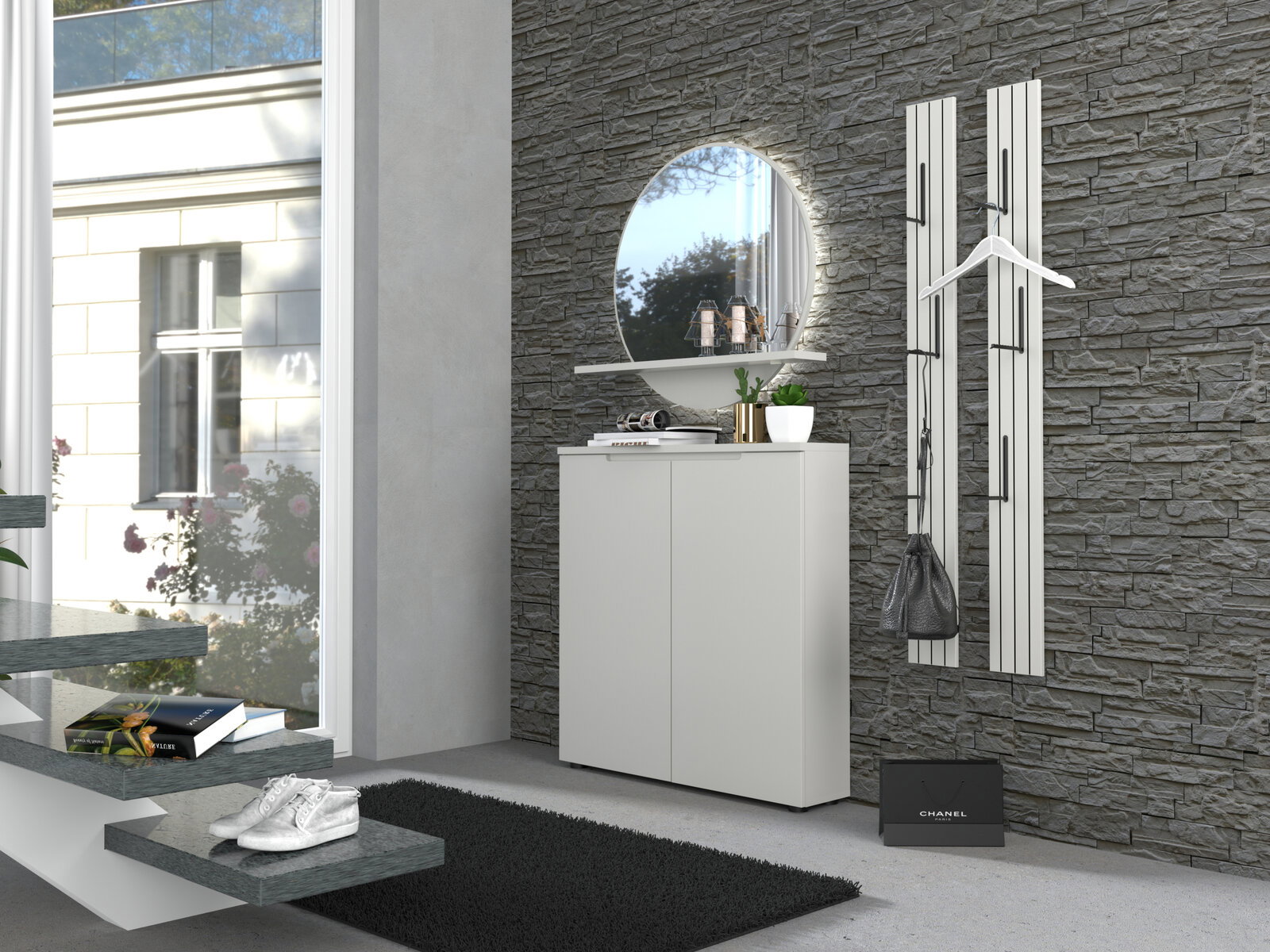 Modernes Flur-Set mit weißem Schuhschrank, rundem Wandspiegel mit Ablage und zwei weißen Wandgarderoben an grauer Steinwand, seitliche Perspektive