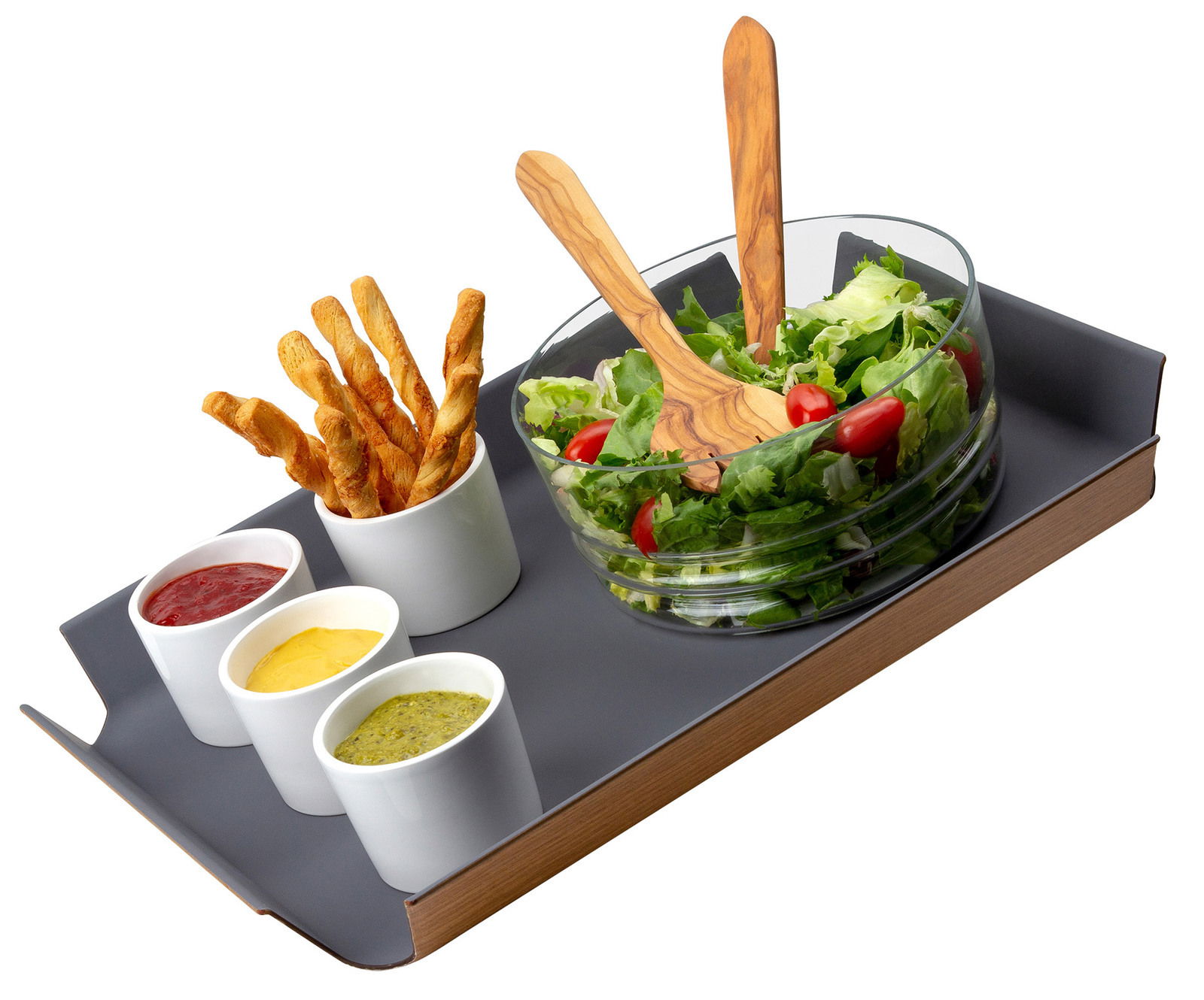 Graues, rutschfestes Tablett mit einer Salatschüssel, drei kleinen Schälchen mit Dips und Brotstangen, aus der Vogelperspektive.
