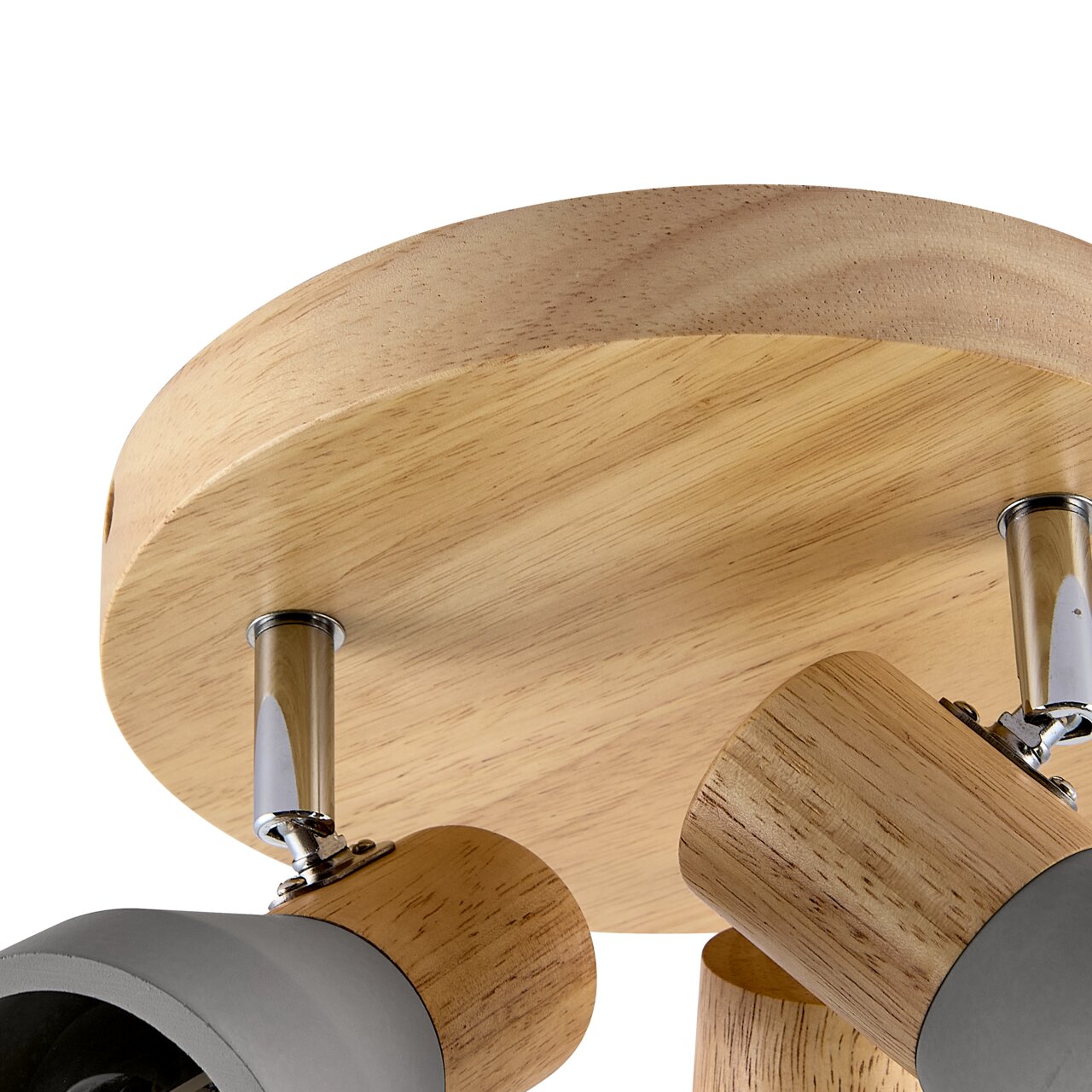 Nahaufnahme eines modernen Strahlers mit Holz- und Metallelementen, von unten betrachtet.