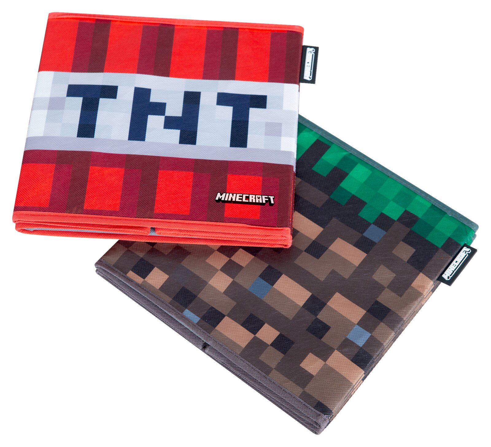 Zwei Minecraft-Notizbücher mit pixeligem Design, vorne rot mit TNT-Schriftzug und Minecraft-Logo, dahinter grau-grün gemustert, schräg von oben in leichter Seitenansicht fotografiert.