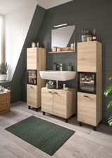 Moderner Waschbeckenunterschrank in Holzoptik, frontal fotografiert, mit zwei Türen und schwarzen Griffen, Teil eines stilvollen Badezimmersetups.