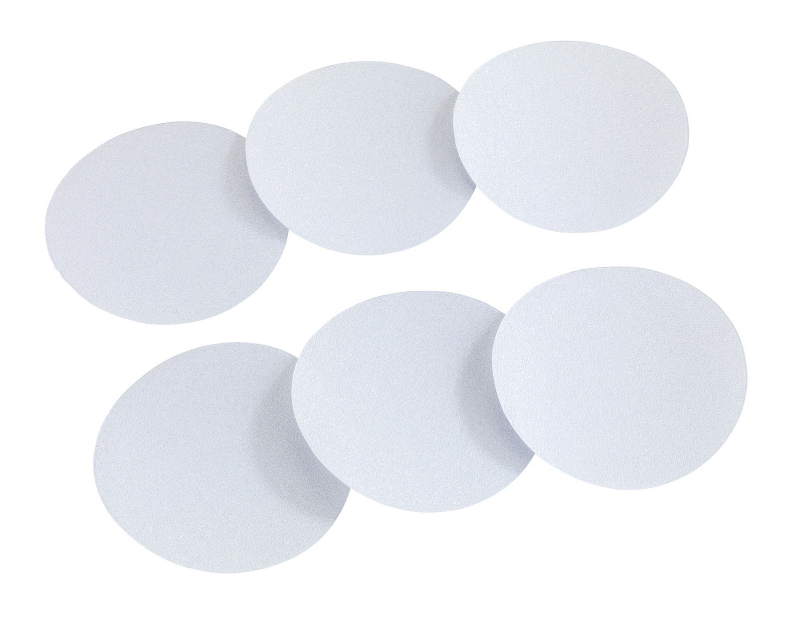 Sechs runde, weiße Anti-Rutschsticker aus der Vogelperspektive.