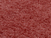 Nahaufnahme eines weichen, rosafarbenen Teppichs mit flauschiger Textur, Draufsicht