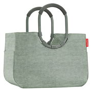 Grüne Einkaufstasche mit stabilen Griffen, seitliche Perspektive