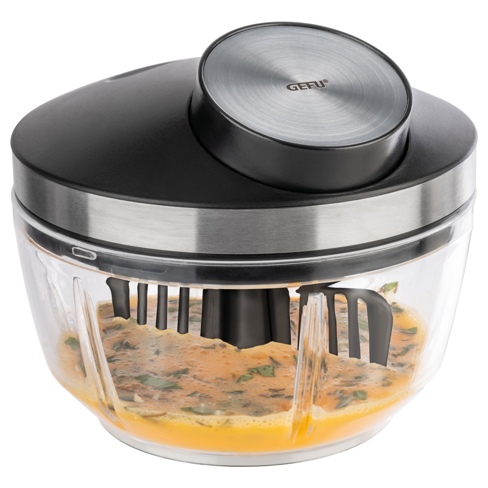 Multizerkleinerer ZIZO von oben, mit transparentem Behälter und schwarzem Deckel, gefüllt mit gehackten Zutaten.