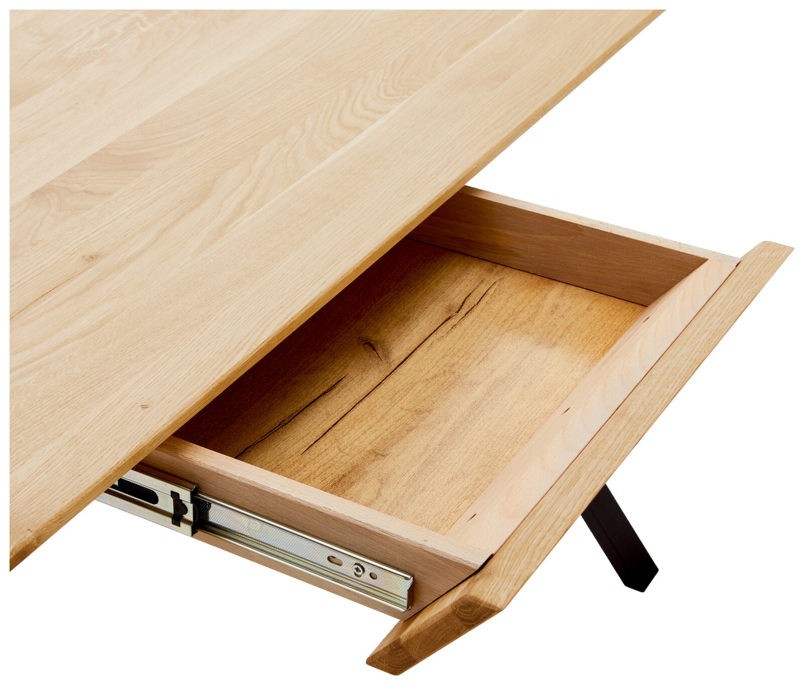 Close-up van een bureau van lichtgekleurd hout met een geopende lade, gezien van bovenaf.