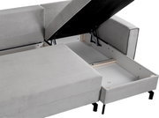 Graues Schlafsofa in L-Form mit geöffneter Stauraumfunktion, Perspektive von oben.