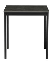 Moderner schwarzer Esstisch aus Metall, frontal fotografiert