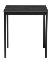 Moderner schwarzer Esstisch aus Metall, frontal fotografiert