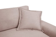Nahaufnahme eines Big-Sofas mit geripptem Stoffbezug und einem passenden Kissen, seitliche Perspektive.