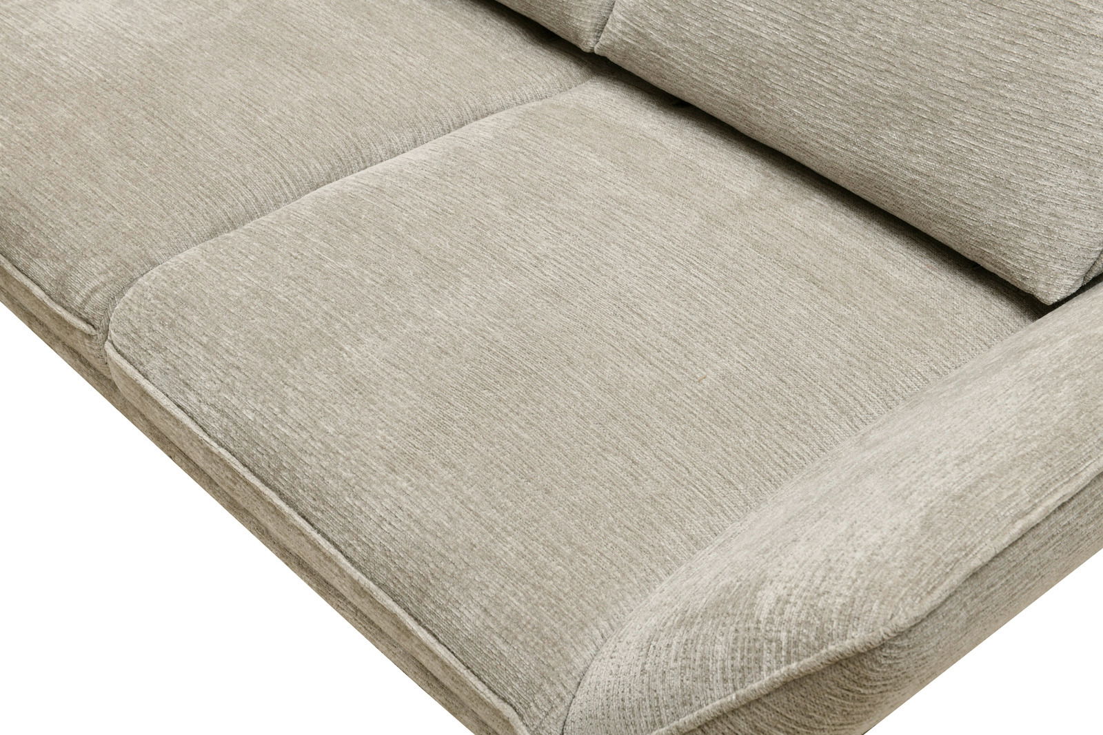 Nahaufnahme eines beigen Longchair-Sofas mit weicher Polsterung, von oben betrachtet.