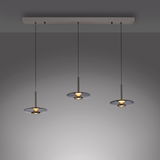 Drei moderne Pendelleuchten PURE Vitrum in einer Reihe, von unten betrachtet, mit elegantem, minimalistischem Design und warmem Licht.