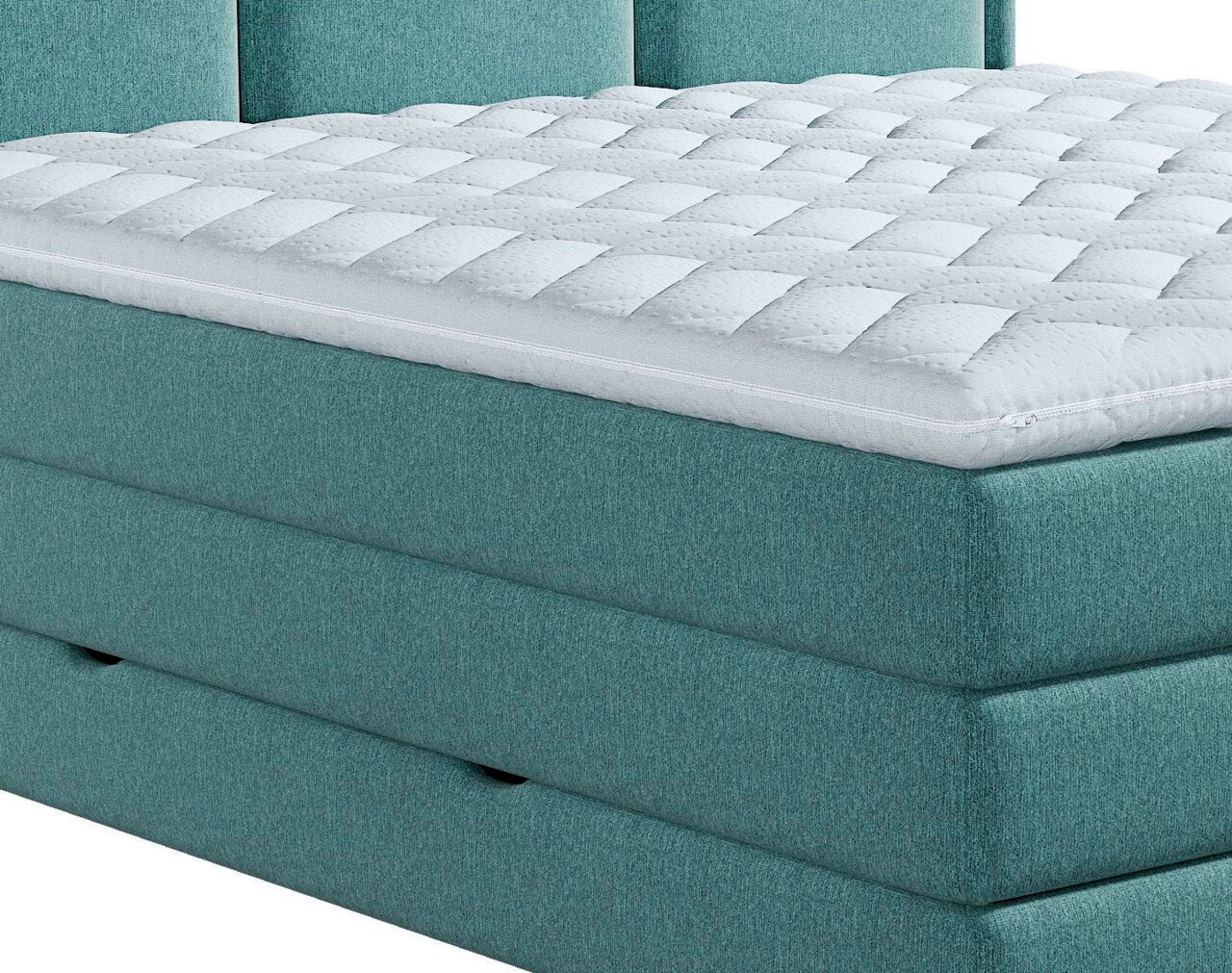 Close-up van een turkoois boxspringbed met een gewatteerde topper, gezien vanaf de zijkant