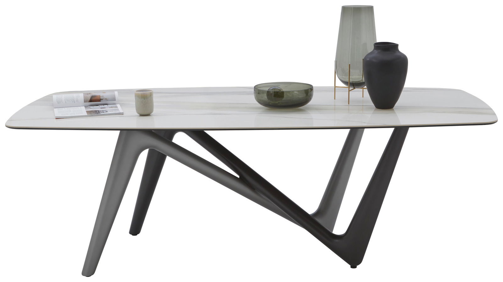 Moderner Esstisch mit weißer Tischplatte und schwarzen, geometrischen Beinen, seitliche Perspektive